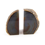 Agate bookends, front view showing raw exterior and polished interior bands.