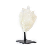 Raw quartz cluster on metal stand for home decor, angled view of right side against white background.