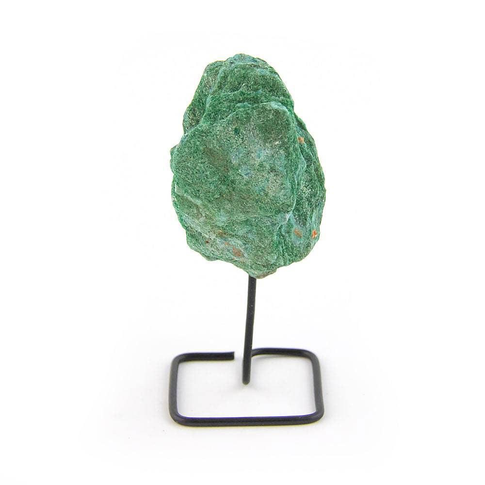 Raw Fuchsite crystal with green shimmer on black metal stand, isolated on white background.