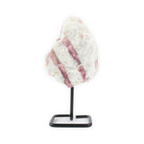 Front view of raw pink tourmaline crystal on metal stand.