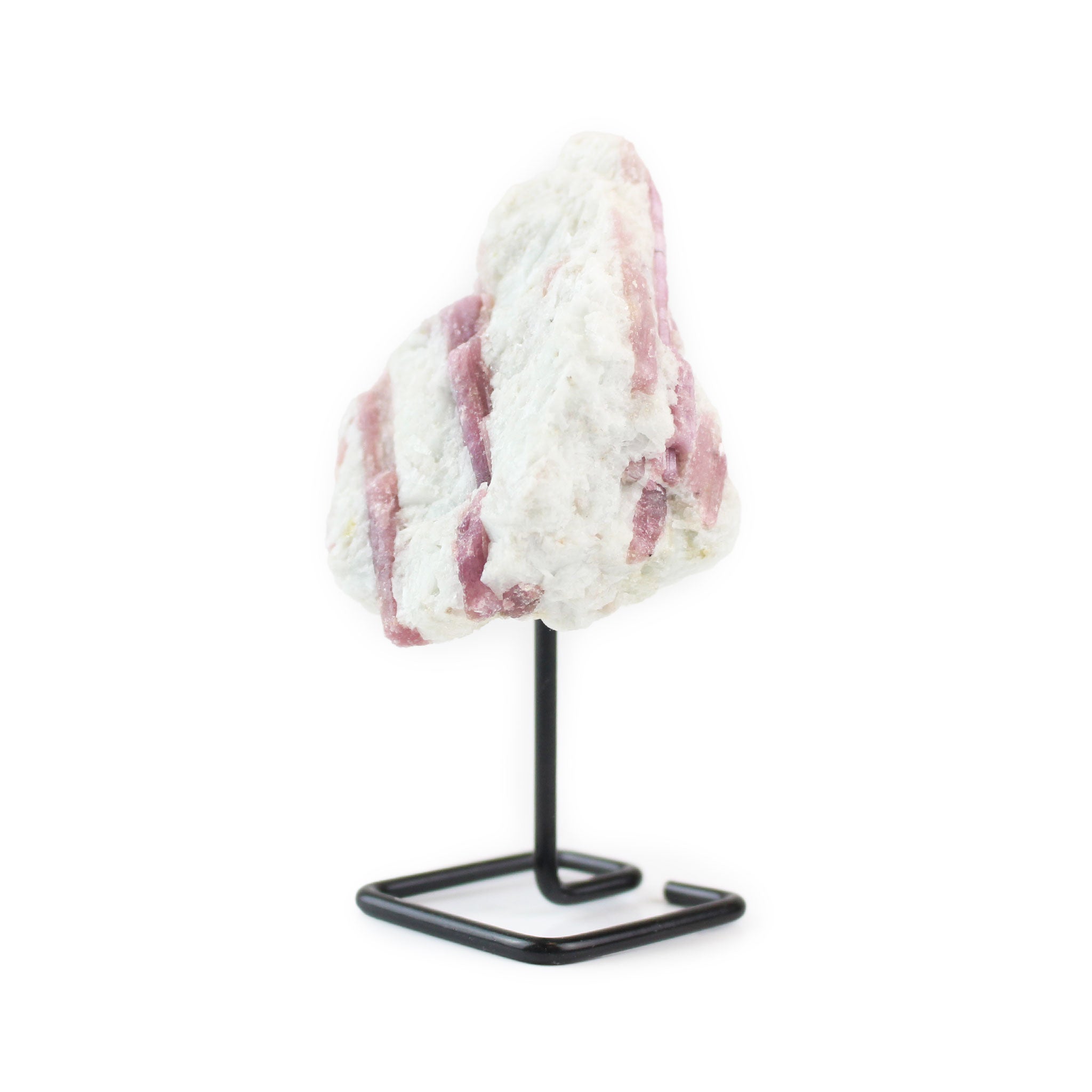 Right angled view of raw pink tourmaline crystal on metal stand.