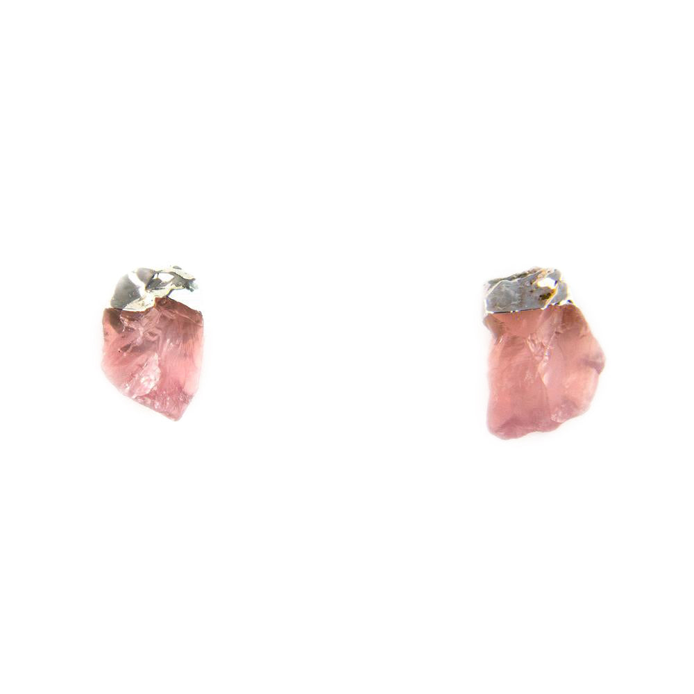 Front view of raw rose quartz stud earrings in silver-tone setting on white background.