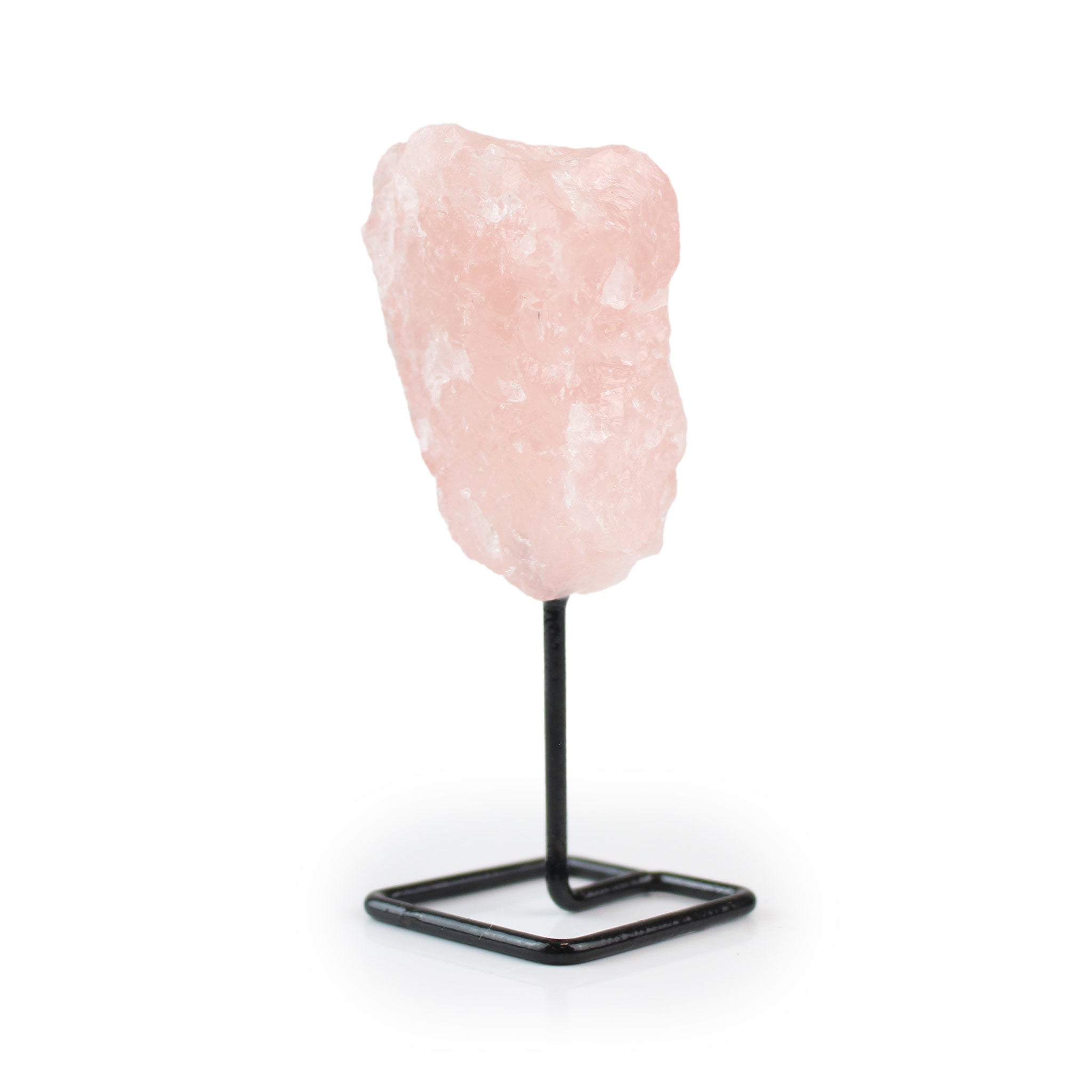 Raw rose quartz on metal stand for home decor, angled view of right side against white background.
