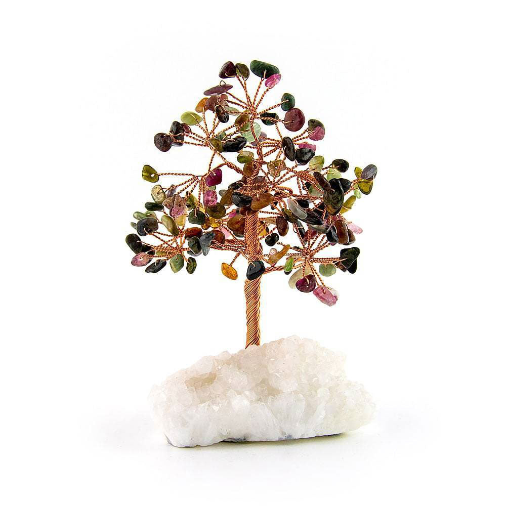 Tourmaline copper tree rooted in white crystal base against white background for spiritual home decor.