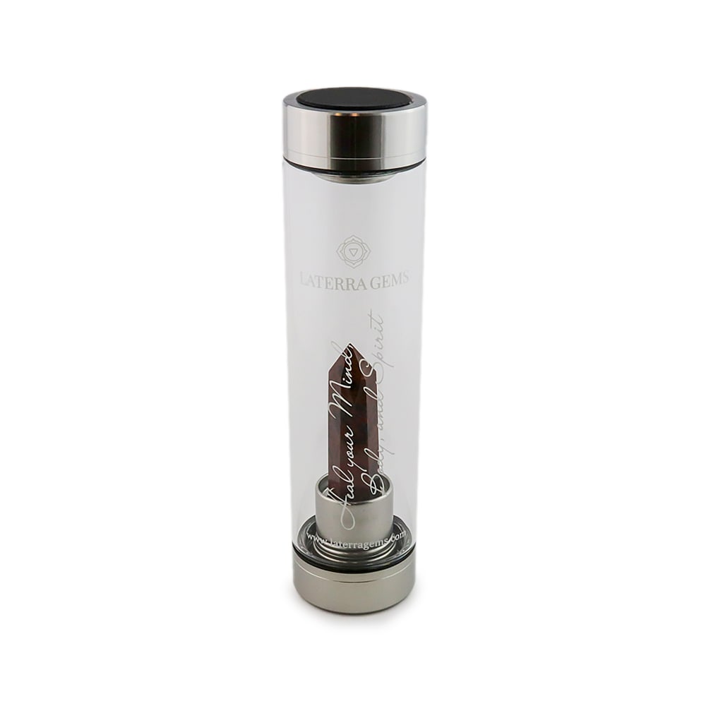 Aries Laterra Gemstone Water Bottle with Red Jasper crystal attachment inside clear glass bottle on white background.