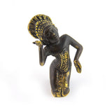 Brass figurine of a kneeling dancer with ornate headdress and graceful hand pose, front facing on white background.