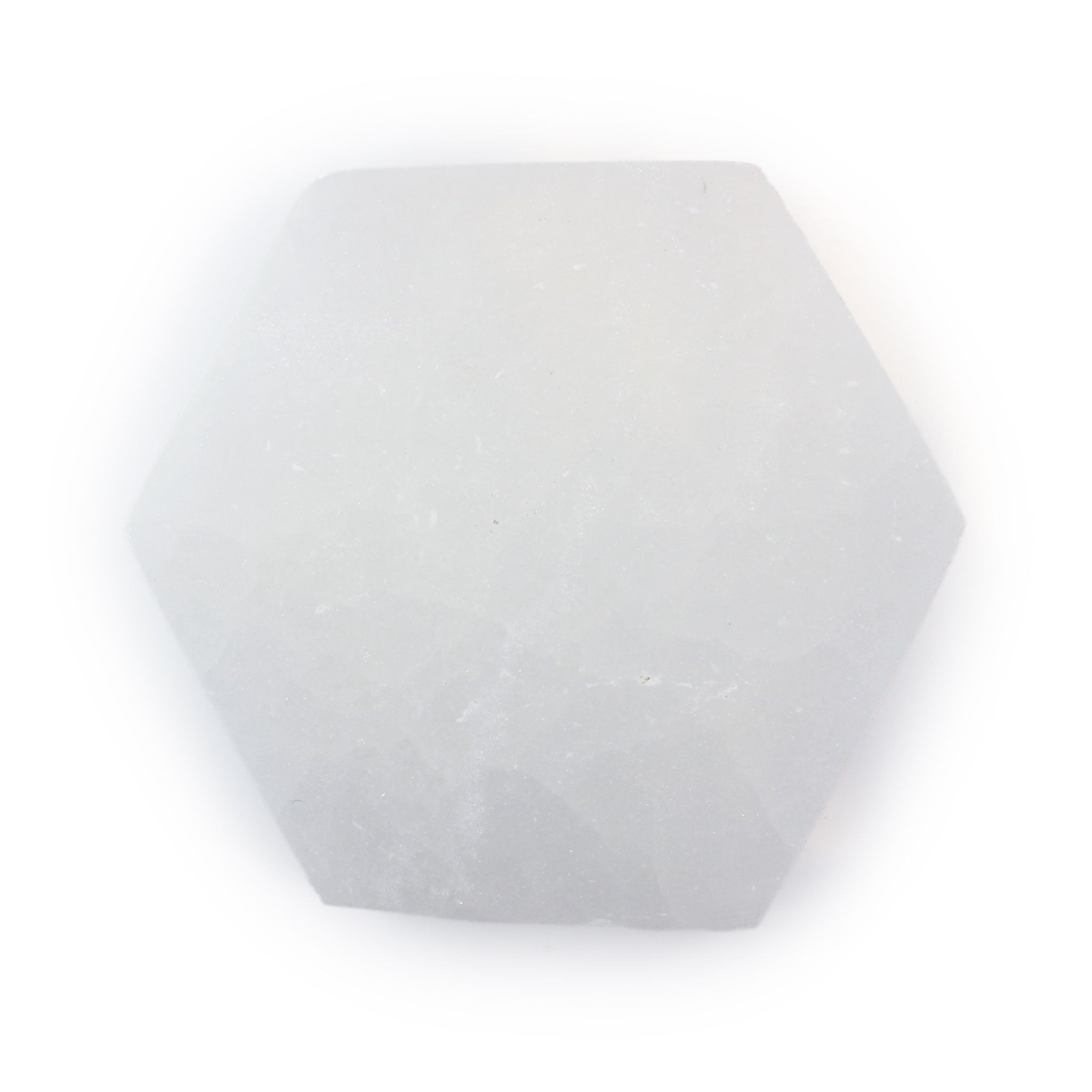 Top view of a polished selenite hexagon coaster showing its translucent white glow and natural texture on a white background.
