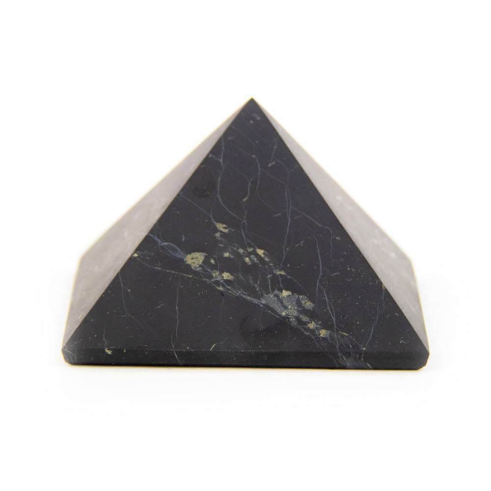 Shungite pyramid on white background, side view showing unpolished stone surface.