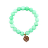 Light green aventurine gemstone beaded bracelet with gold charm centerpiece.