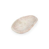 Left angled view of large pink amethyst gemstone bowl on white background.