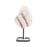 Front view of raw pink tourmaline crystal on metal stand.