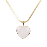 Front view of Rose Quartz Heart Stone Pendant in gold tone frame showing polished pink crystal.