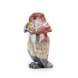 Right side profile of soapstone owl carving.