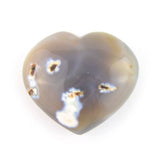 Polished agate heart stone, front view, heart-shaped polished agate with layered colors on white background.