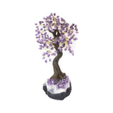 Oversized Amethyst bonsai tree with tumbled stones on amethyst base for luxury crystal décor and meditation.