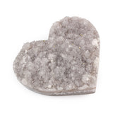 Angled view of large Amethyst Gemstone Heart highlighting rough crystal face and smooth carved edges.