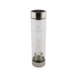 Cancer Laterra Gemstone Water Bottle with crystal quartz crystal attachment inside clear glass bottle on white background.