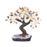 Large Chakra bonsai tree sculpture with tumbled stones on raw amethyst foundation.