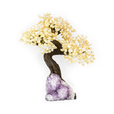 Grand citrine gemstone bonsai tree with amethyst base, designed for luxury décor and manifestation.
