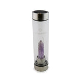 Gemini Laterra Gemstone Water Bottle with amethyst crystal attachment inside clear glass bottle on white background.