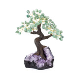 Large green quartz bonsai tree sculpture with tumbled green quartz leaves on amethyst foundation.