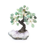 Small green quartz bonsai tree with tumbled gemstone leaves on raw amethyst base.