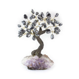 Medium hematite crystal bonsai tree with tumbled stones wired to amethyst base.