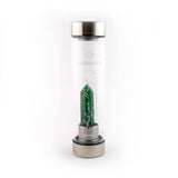Laterra Gemstone Water Bottle with green quartz crystal point attachment inside glass bottle.