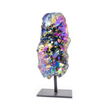 Small rainbow titanium quartz on black metal base, front facing, iridescent colors on white background.