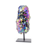 Small rainbow titanium quartz on black metal base, front facing, iridescent colors on white background.