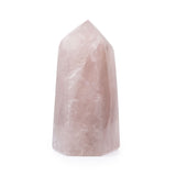 Rose quartz point, angled view highlighting natural inclusions and gentle glow.