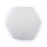 Top view of a polished selenite hexagon coaster showing its translucent white glow and natural texture on a white background.