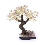 Large smoky quartz bonsai tree sculpture with tumbled gemstones on raw amethyst foundation.