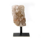Raw smoky quartz crystal displayed on a metal base for home decor, front view against white background.