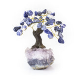 Small Sodalite bonsai tree with tumbled gemstone leaves on raw amethyst crystal base.