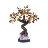 Large tiger eye gemstone bonsai tree sculpture with amethyst crystal foundation.