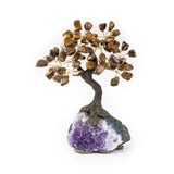 Medium tiger eye bonsai tree with tumbled tiger eye leaves on raw amethyst base.