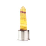 Yellow rainbow fluorite attachment for Laterra Gemstone Water Bottle, polished crystal point in metal base on white background.